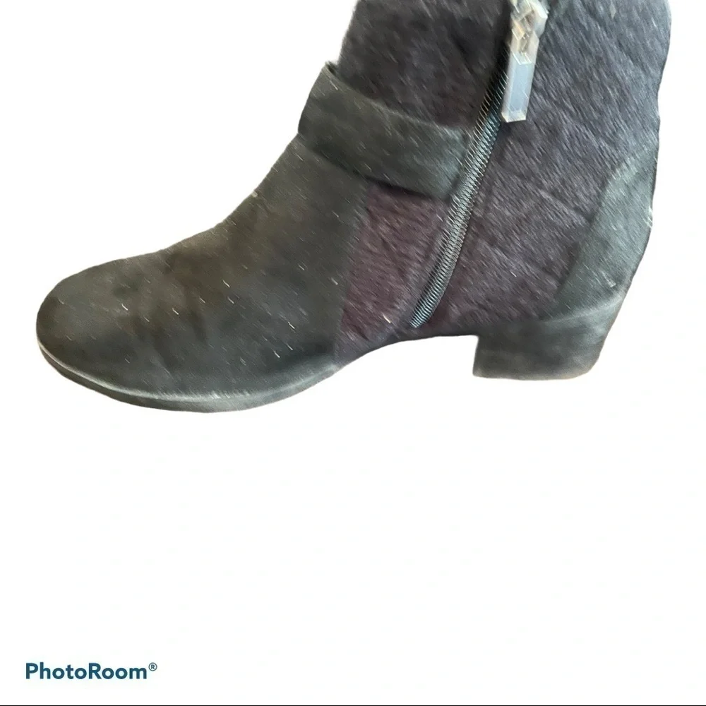 Women’s black ankle boots with buckle accents